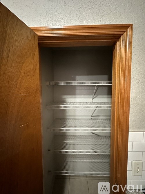 A wooden door with a glass pane in the middle.