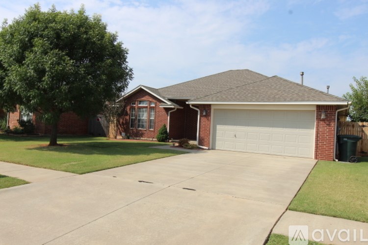 A house with a garage and a driveway.
