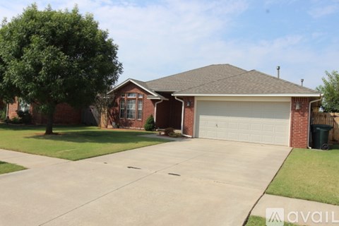 A house with a garage and a driveway.