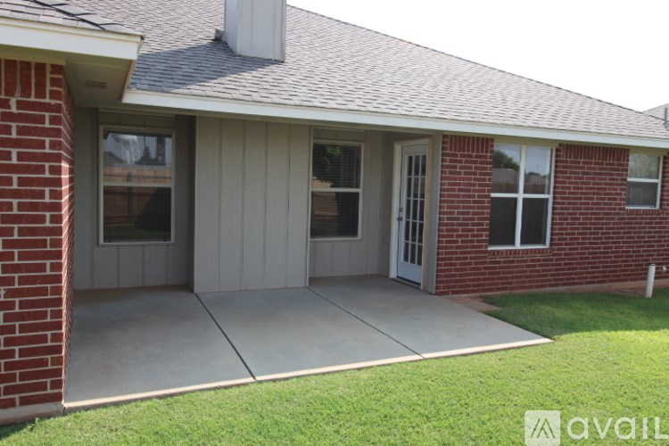 A house with a grey roof and a white door.