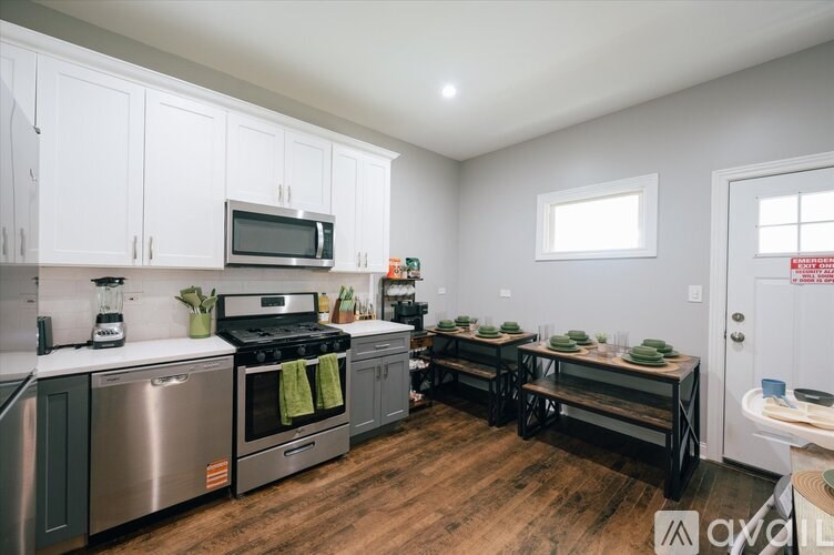 A kitchen with a stove, oven, and microwave.