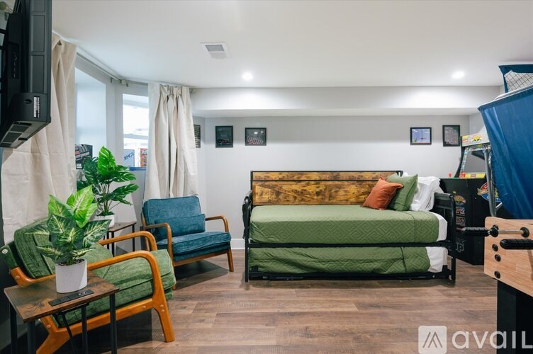 A living room with a green sofa and a wooden coffee table.