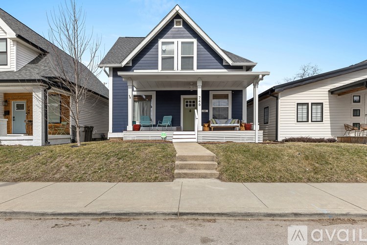 A house with a blue front door is for sale.