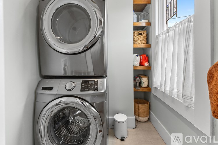 A washing machine and dryer in a small laundry room.