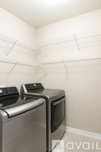 A wall-mounted microwave oven is on top of a dishwasher.