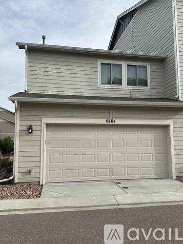 A house with a garage door that is 6'10" tall.