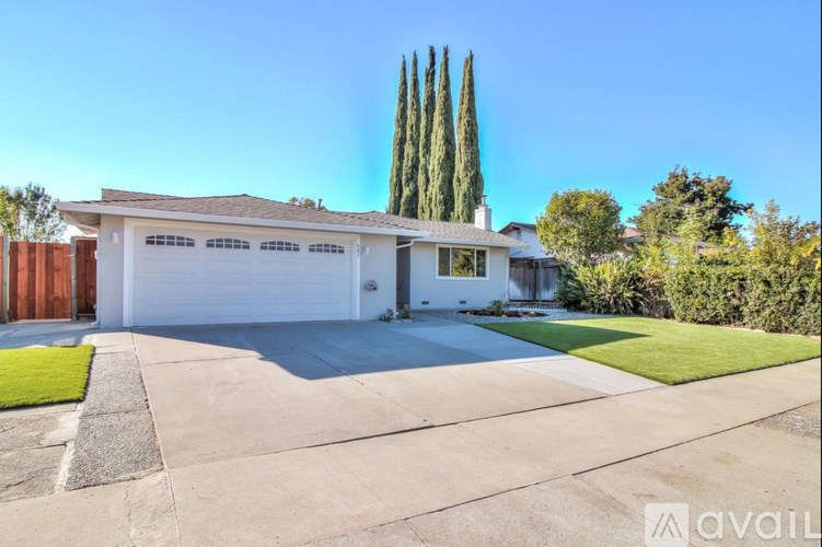 A house with a white garage door is for sale.