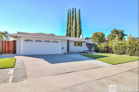 A house with a white garage door is for sale.