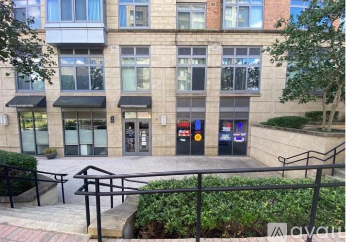 A building with a black awning and a glass door.