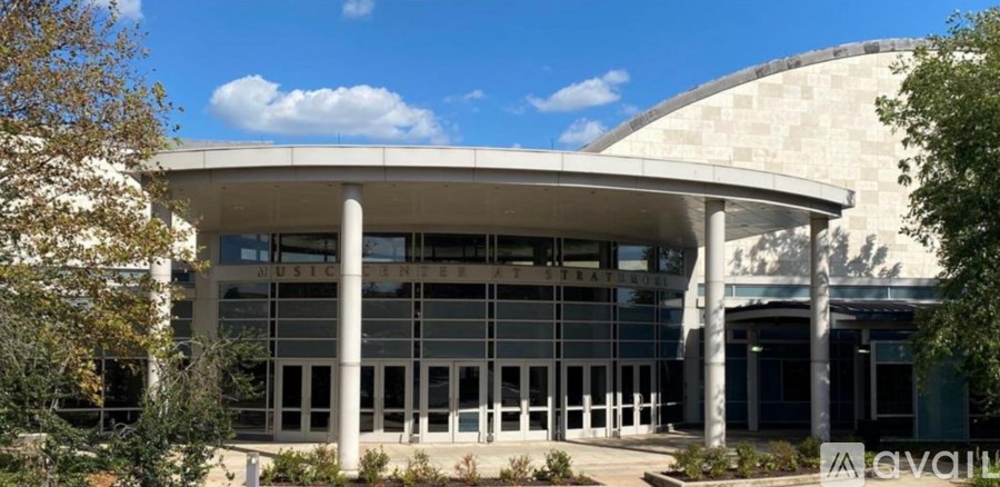 A modern building with a curved roof and large windows.