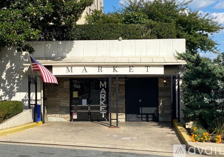 A market building with an American flag hanging outside.