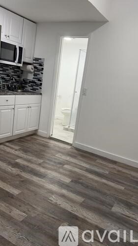A kitchen with a microwave and a countertop.