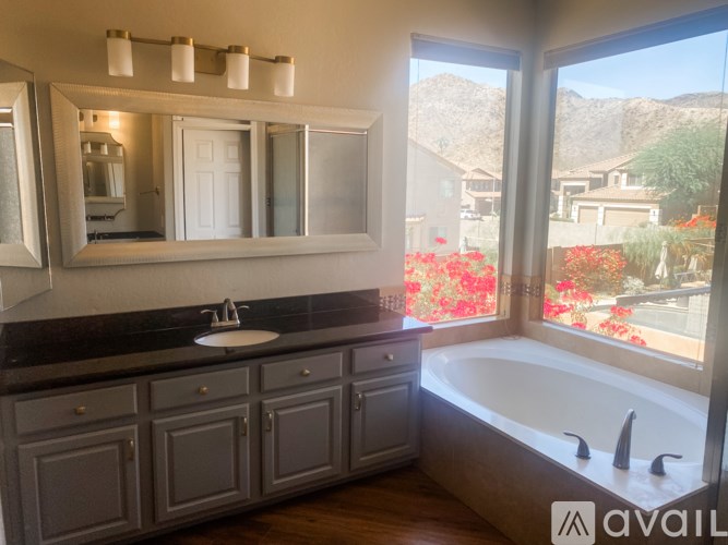 A bathroom with a tub and a sink.
