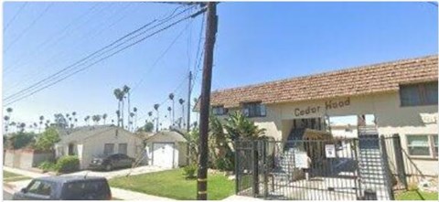 A building with the name Cedar House on it.