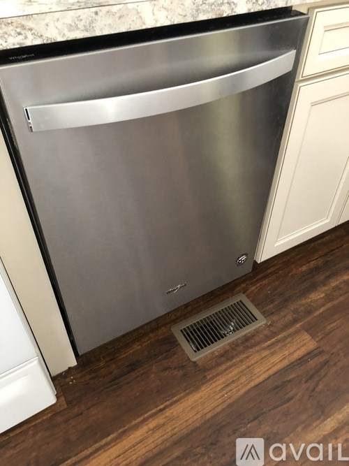 A stainless steel dishwasher in a kitchen.