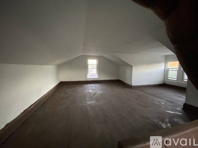 A room with wooden floors and white walls.