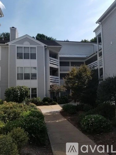A building with a walkway in front of it.