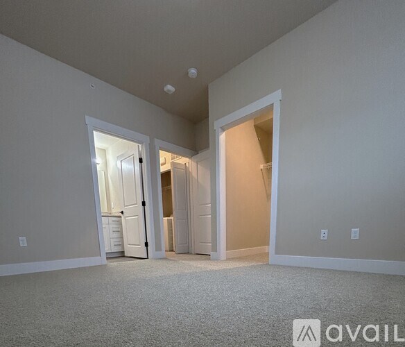 A room with two open doors leading to other rooms.