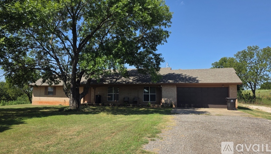 A house with a tree in front of it.