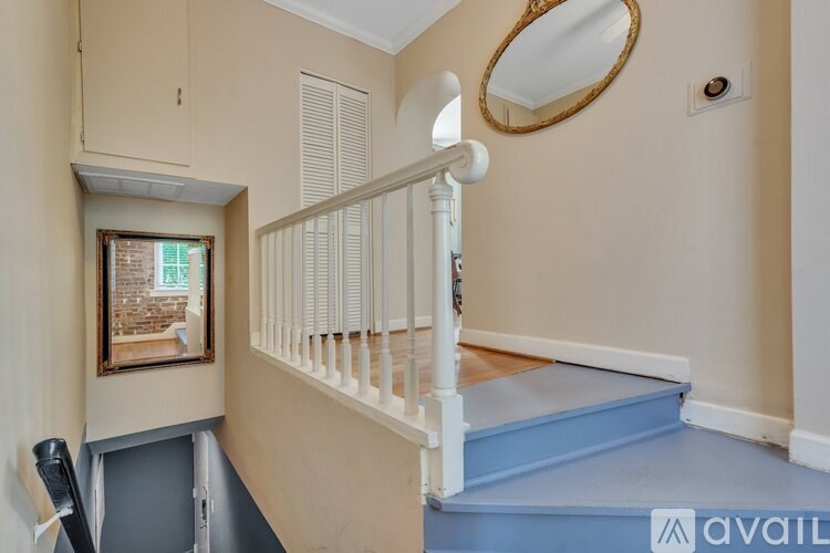 A room with a staircase leading to the second floor.