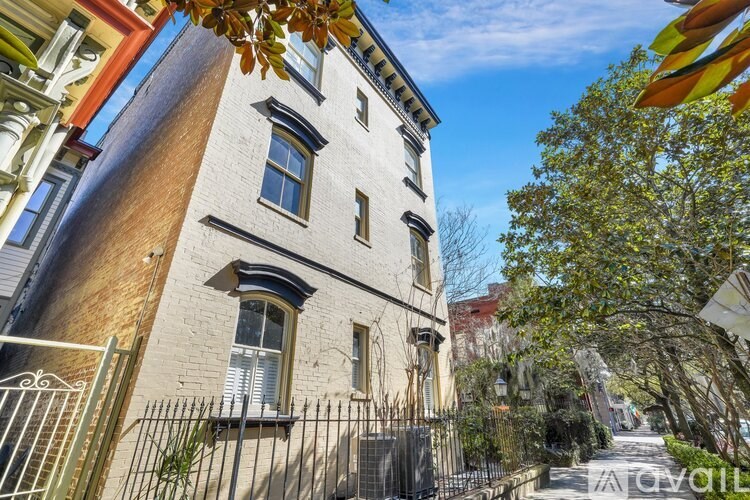 A tall building with a fence in front of it.