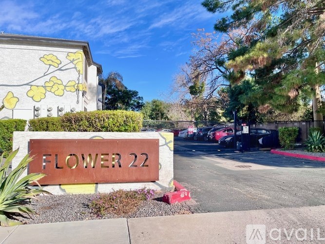 A sign that says Flower 22 in front of a building.