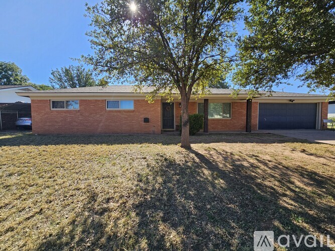 A house with a tree in front of it.