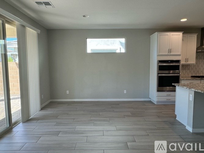 A kitchen with a countertop and cabinets is available for rent.