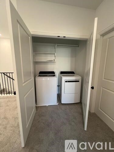 A laundry room with a washer and dryer.
