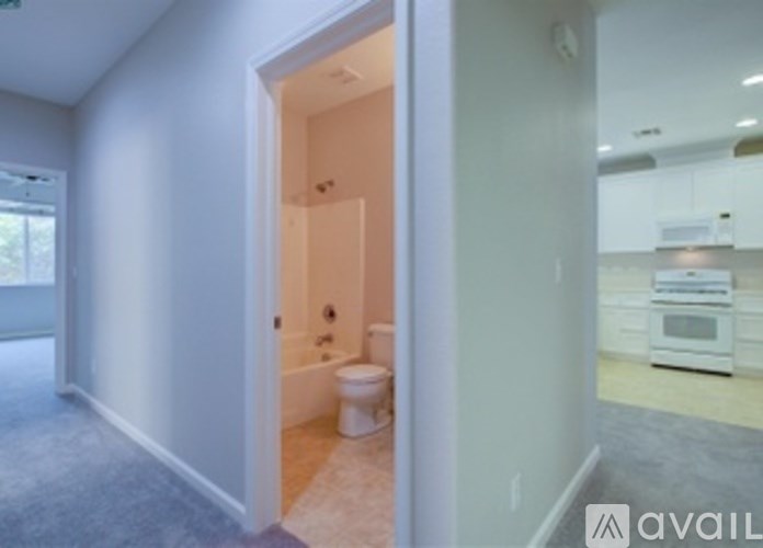 A bathroom with a toilet and a sink.