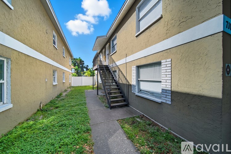 A building with a staircase leading to the second floor.