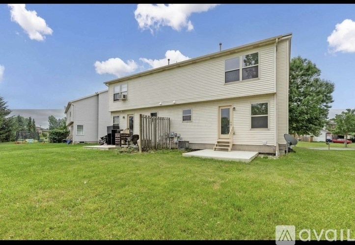 A house with a lawn in front of it.