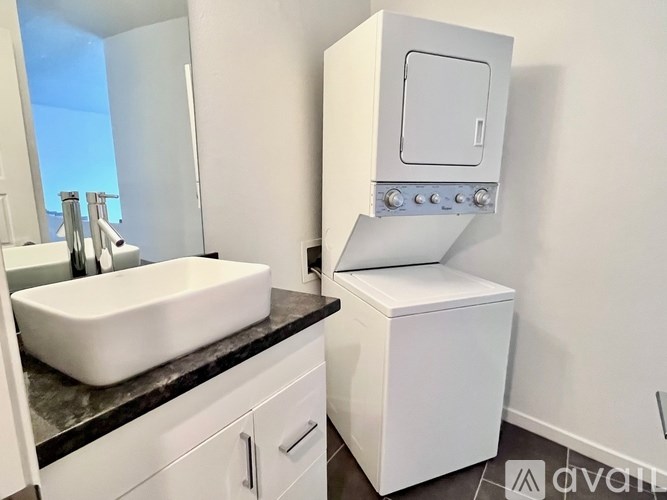 A white sink and toilet in a bathroom.