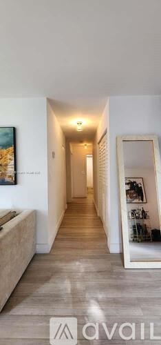 A long hallway with a light at the end.