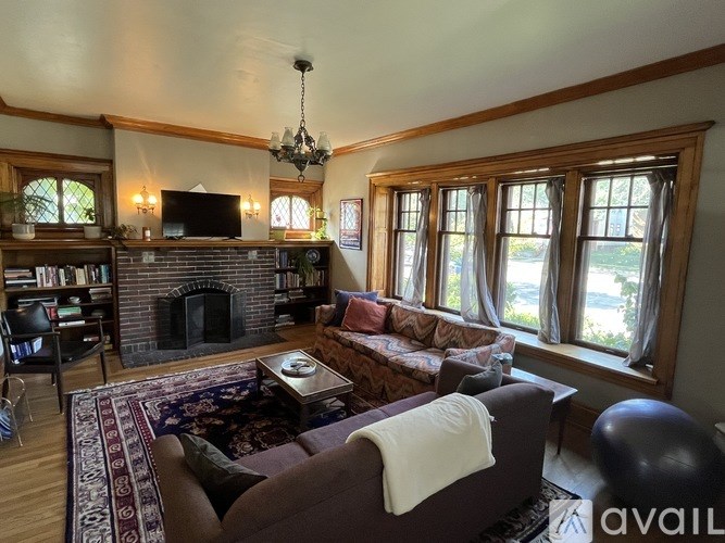 A living room with a fireplace and a couch.