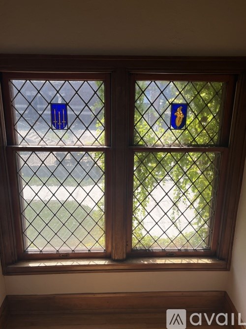 A window with a blue and yellow sticker on it.