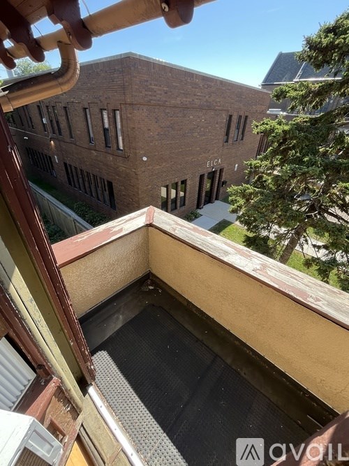 A view from a window of a building with the word "EICHA" on it.