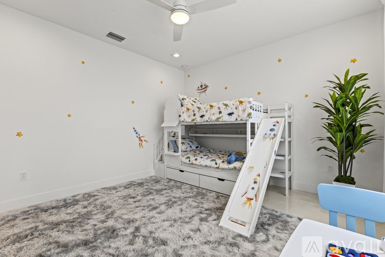 A child's room with a white bunk bed and a grey carpet.