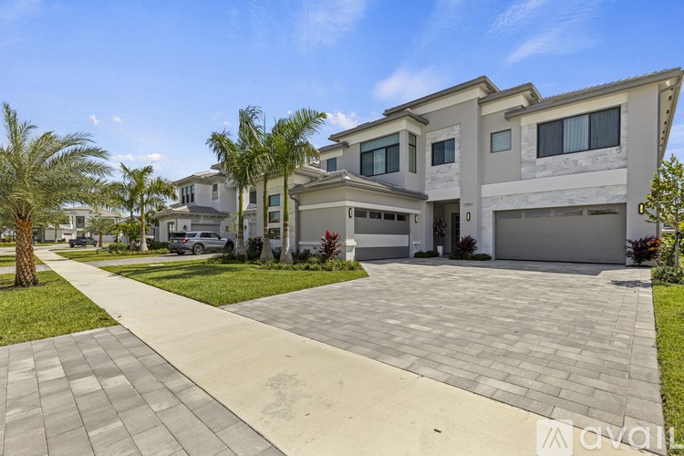 A modern house with a driveway in front.