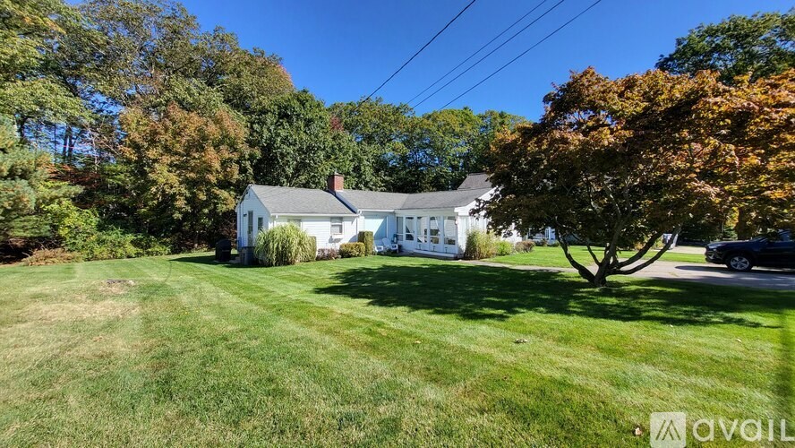 A house with a lawn in front of it is for sale.