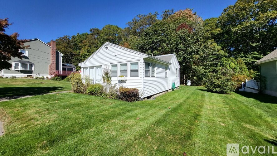 A house with a lawn in front of it is for sale.