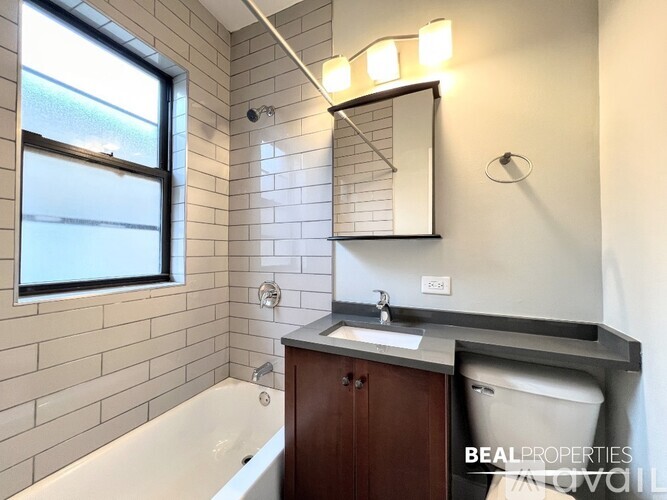A room with a white door and a window with white frames.