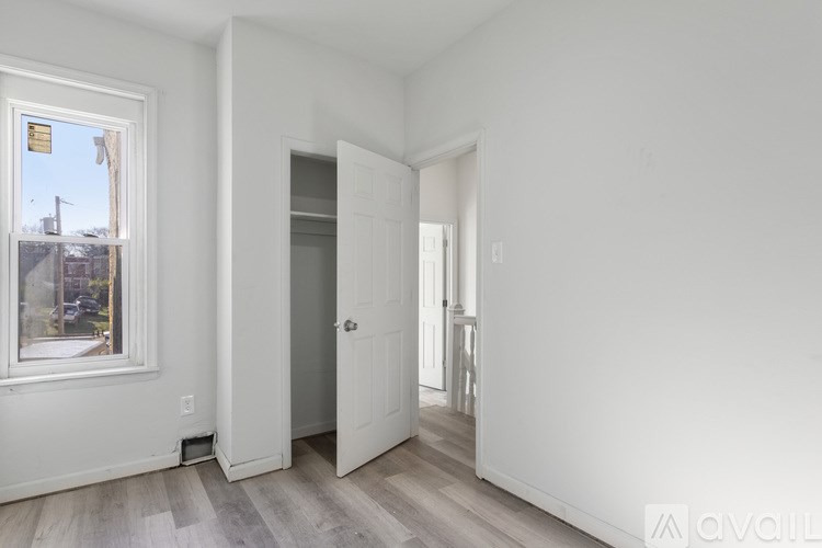 A room with a door and a window.