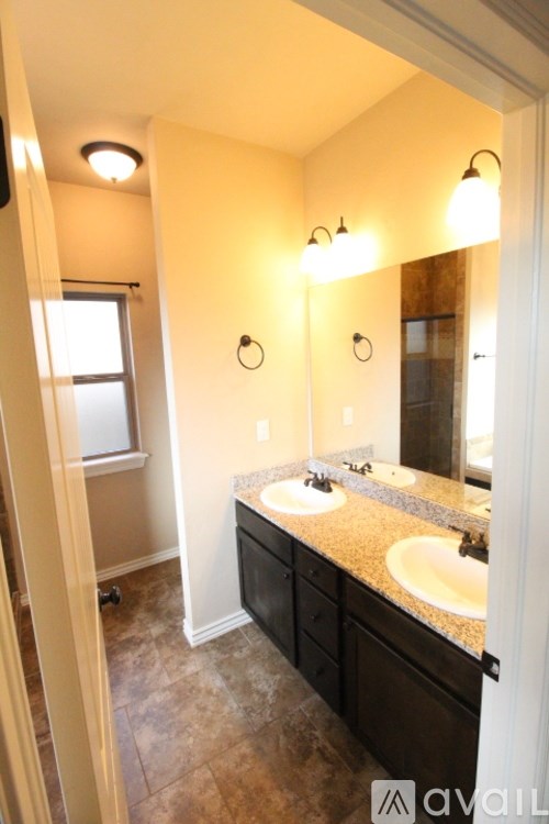A bathroom with a vanity and a mirror.