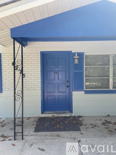 A blue door is on the front of a house.
