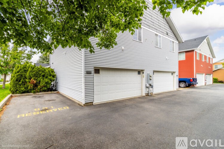 A house with a garage that is for sale.
