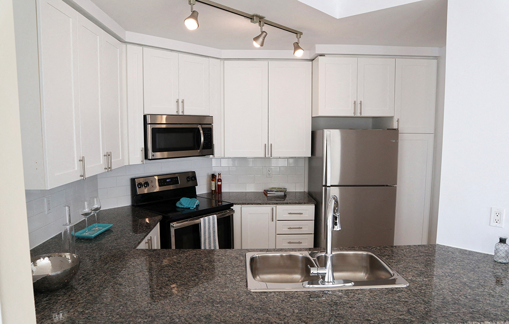 Updated Kitchen with Stainless Steel and White Cabinets
