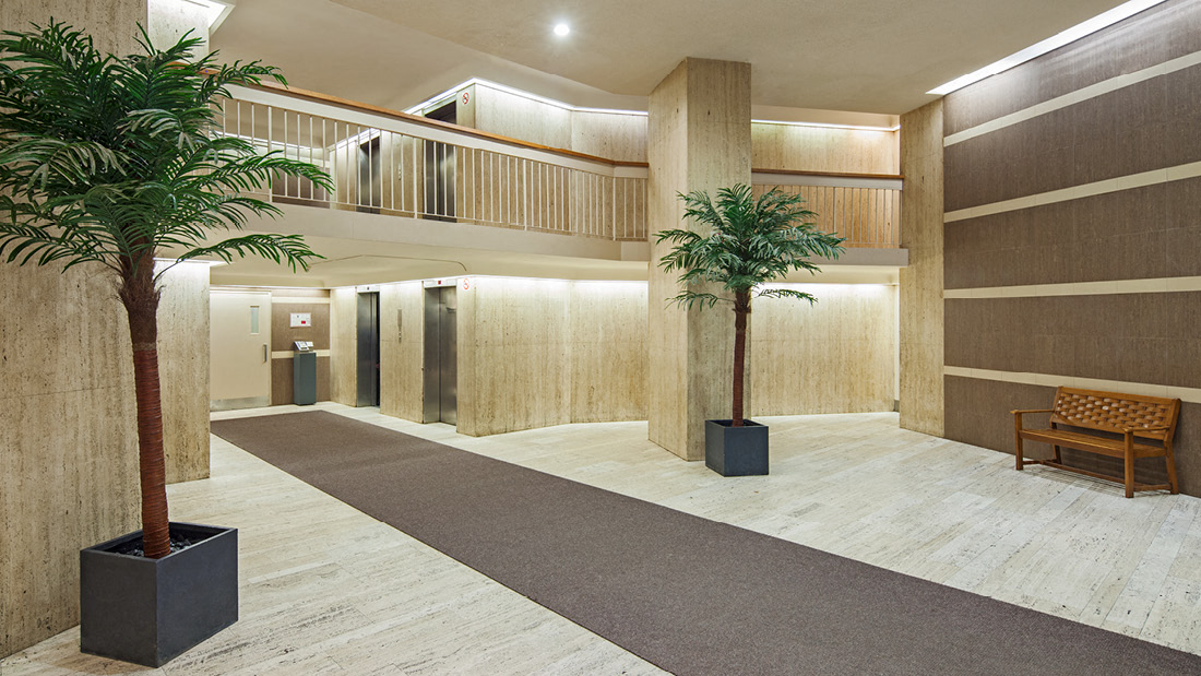 A long corridor with a bench at the end.