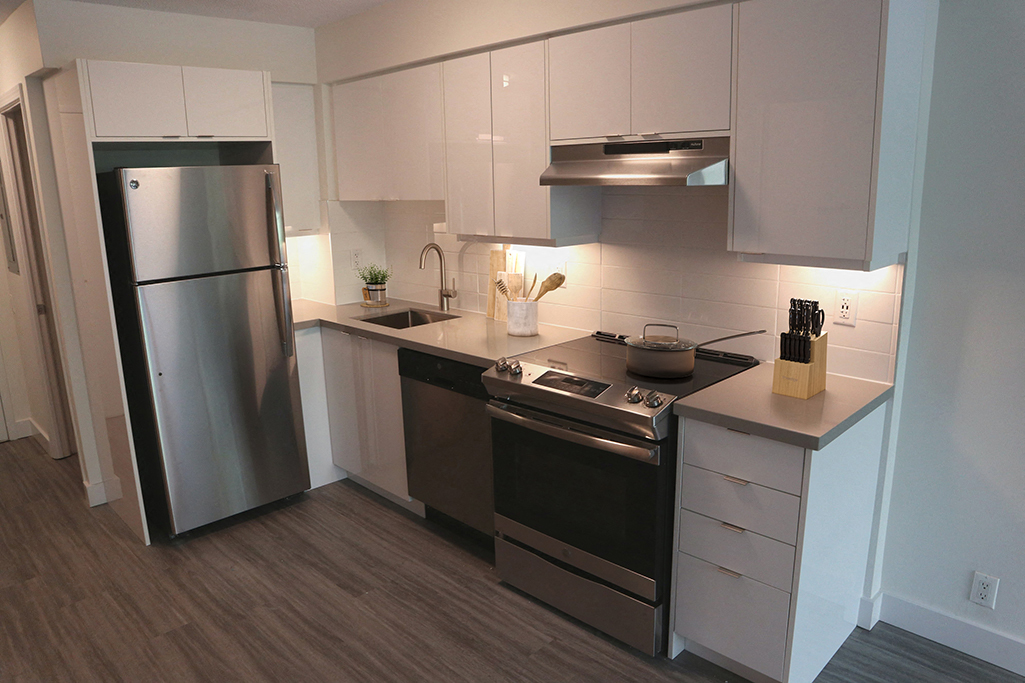 Renovated Kitchen with Stainless Steel Appliances and White Cabinets