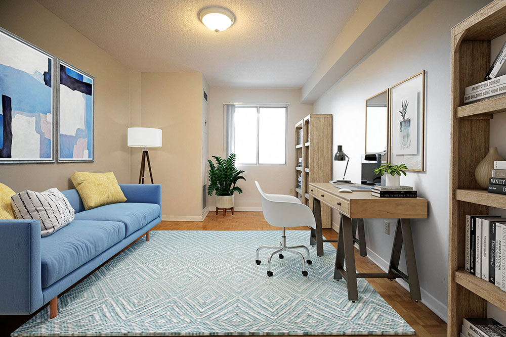a living room with a couch and a desk